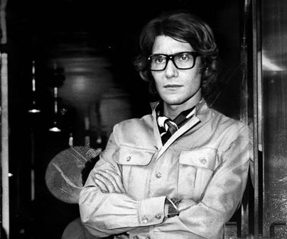 Yves St. Laurent wearing a trenchcoat